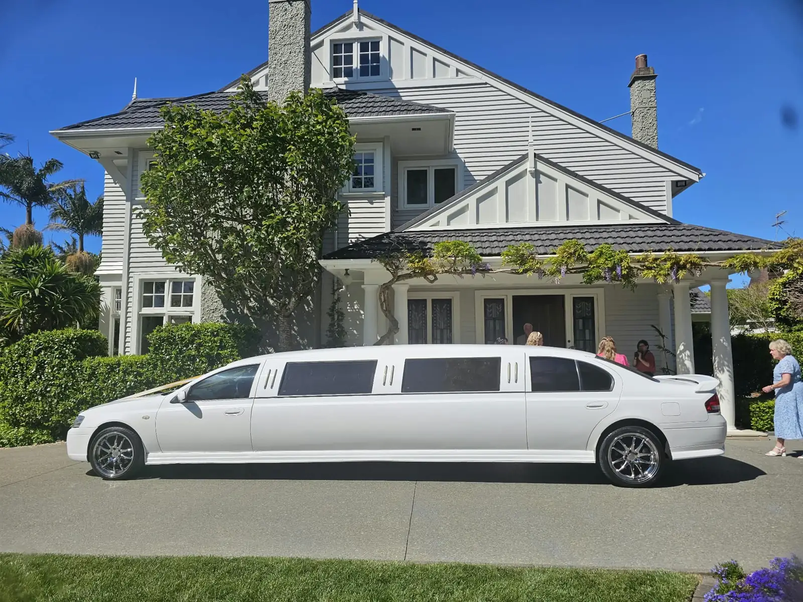 White Ford Falcon wedding limo outside a villa in Auckland